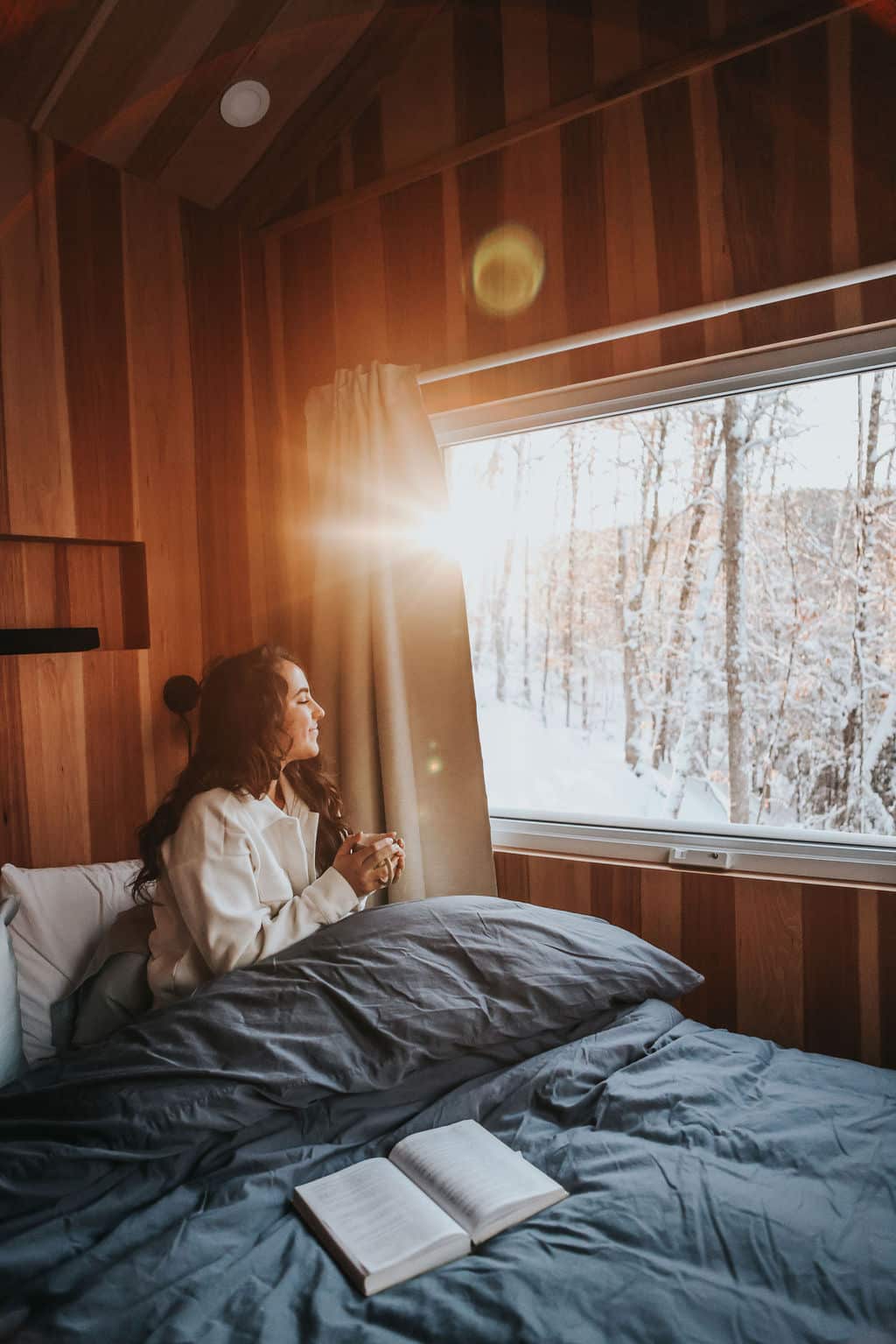Camille in bed at sunrise